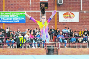 Una gimnasta realitza un salt durant un exercici de terra ahir a la Copa Catalana que es disputa a Bellvís.