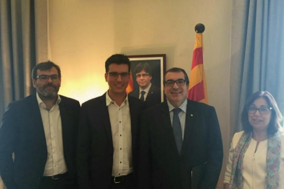 Melé i Postius, a l’esquerra del conseller d’Interior, Jordi Jané.