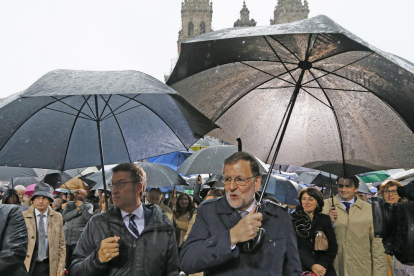 Alberto Núñez Feijóo y Mariano Rajoy, ayer en Santiago de Compostela.