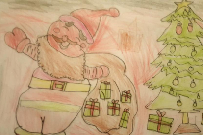 L'Aran de 5 anys ha dibuixat al pare noel amb un sac ple de regals.