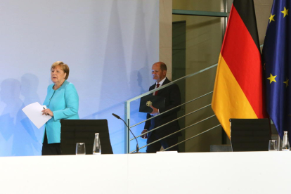 Angela Merkel y su ministro de finanzas, Olaf Scholz.