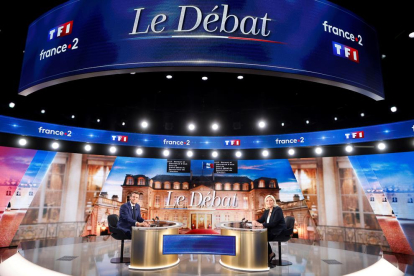 El presidente de Francia y candidato, Emmanuel Macron, y a ultraderechista Marine Le Pen.