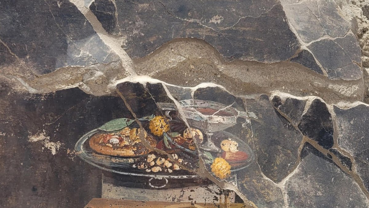 Descobreixen la representació d'un possible avantpassat de la pizza en un fresc a Pompeia
