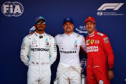 Bottas, Hamilton y Vettel, tras la sesión de calificación.