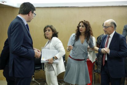 El conseller Mundó, Santamaría y Montoro, ayer.
