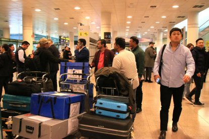 Congresistas del MWC en la zona de llegadas de la T1 del Aeropuerto del Prat de Barcelona