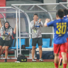 Erica Hernández i Jordi Escura celebren un gol del seu equip, el Qingdao Huanghai.