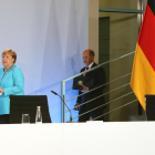 Angela Merkel y su ministro de finanzas, Olaf Scholz.