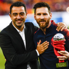 Xavi i Leo Messi van ser companys al Barça i ara formen part de l’equip històric.