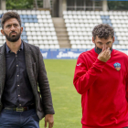 Molo i el seu segon, Jorge Garcés, amb gest abatut a l'acabament del partit.