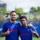 Sergio Busquets, amb Balde en l’entrenament d’ahir.