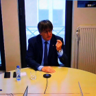El expresidente de la Generalitat Carles Puigdemont ha comparecido como testigo en el juicio de Miquel Buch en la Audiencia de Barcelona desde un juzgado de Bélgica por videoconferencia.