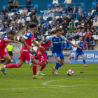 Juan Agüero és perseguit per diversos jugadors de l’Espanyol.