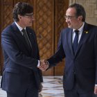 Salvador Illa va rebre ahir el president del Parlament, Josep Rull, al Palau de la Generalitat. - EFE