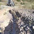 Les quatre imatges mostren diferents trams del camí de la Vall de Reig en males condicions.