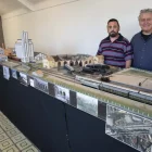 Xavier Hernández i Jaume David Brufau, amb la seua maqueta del ferrocarril d’uns tretze metres. - C.MARSIÑACH