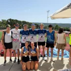 Els atletes del Xafatolls amb les medalles aconseguides a Girona.