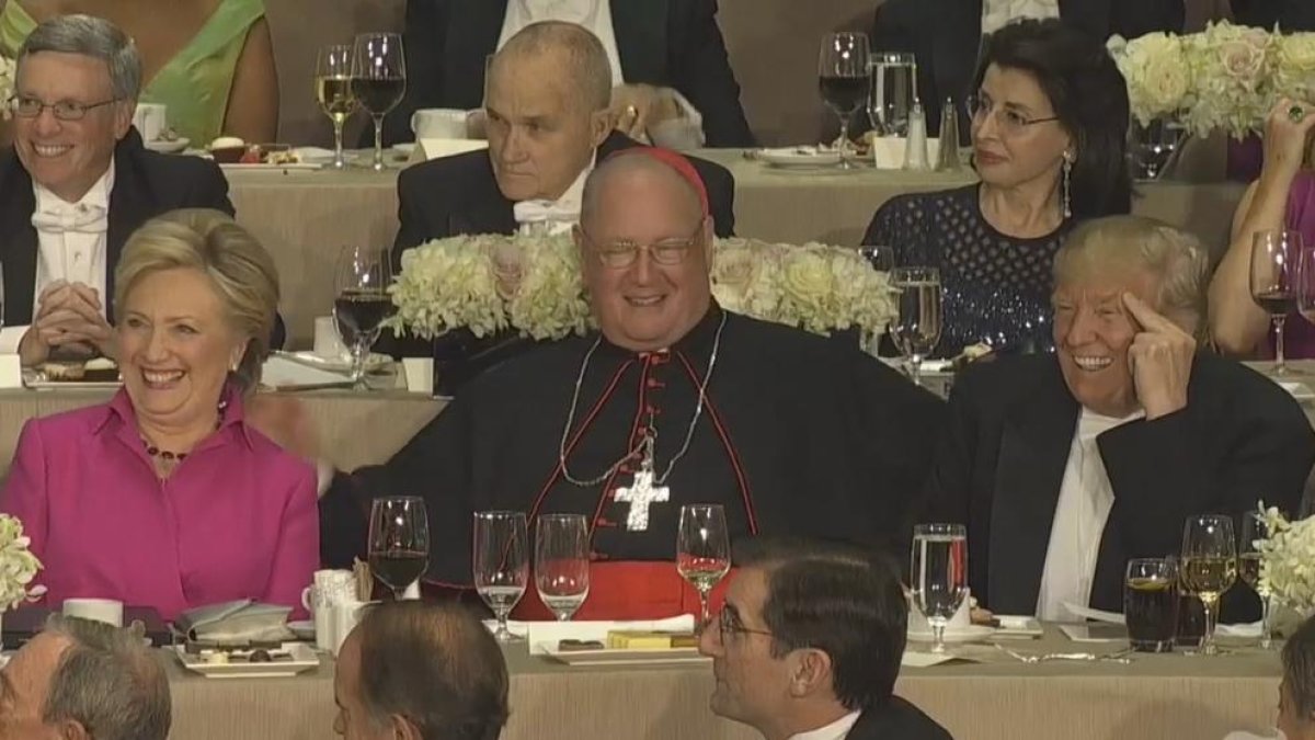 Clinton i Trump, al costat de l’arquebisbe de Nova York.