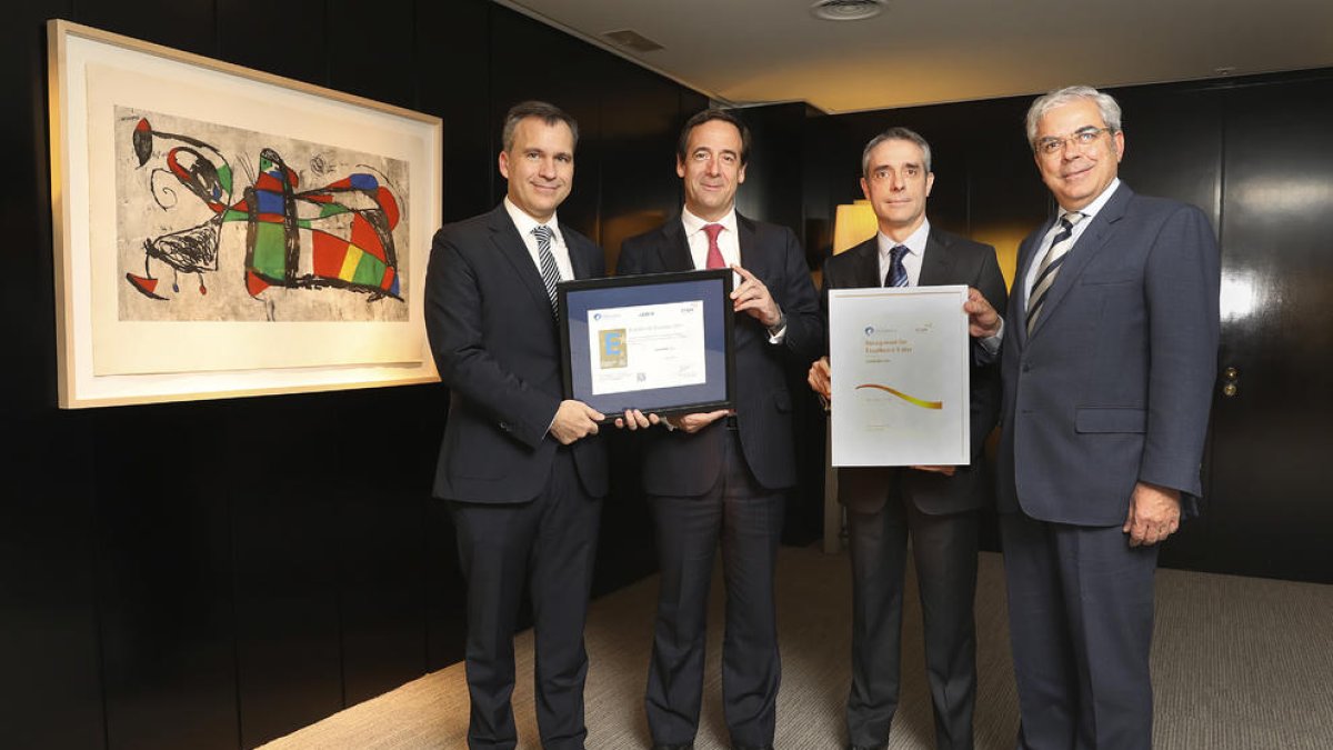 Directius de CaixaBank i d’Aenor.