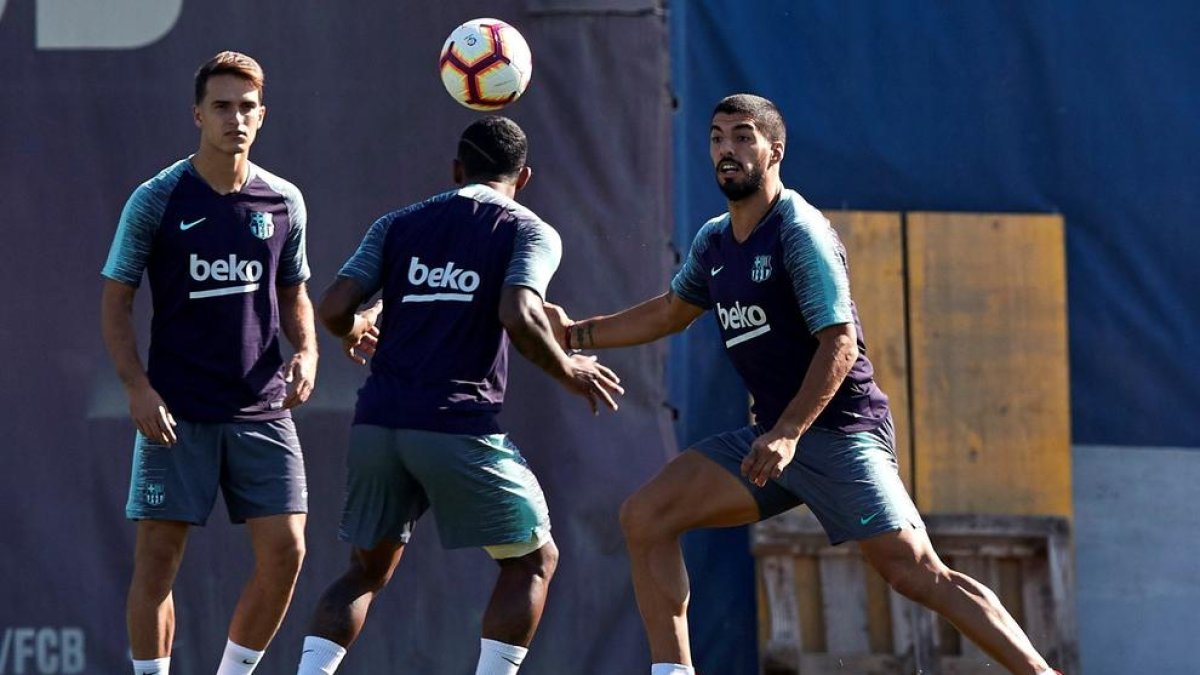 Denis Suárez y Malcom, ayer durante la sesión preparatoria.