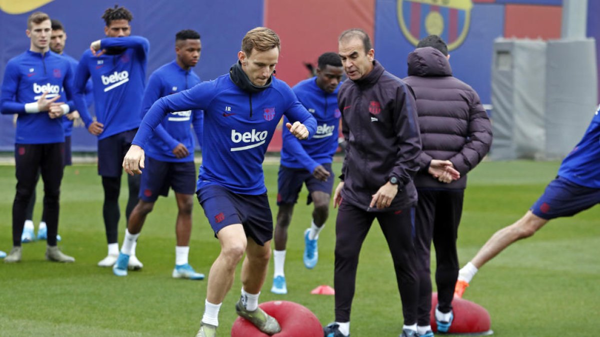 Rakitic ahir amb el preparador físic lleidatà Eduard Pons.