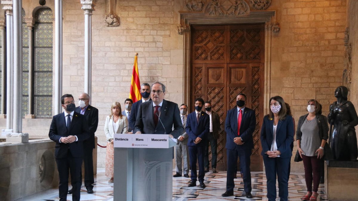 Torra, acompanyat del seu Govern en ple, ahir, durant una compareixença per valorar la resolució.