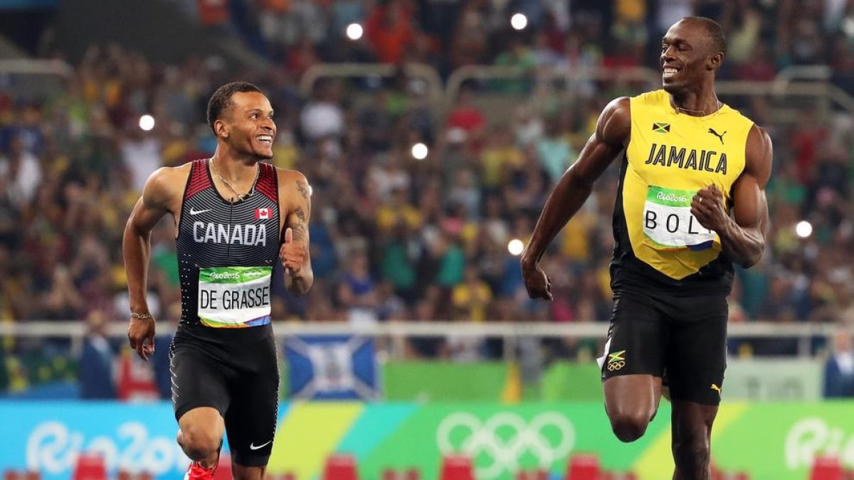 Bolt corrent al costat de De Grasse, absent en el Mundial per lesió.