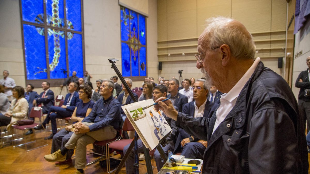 Marc Palahí, amb una aquarel·la d’Ureña, entre el rector, el president d’Alumni UdL i representants del Grup SEGRE i Banc Santander.